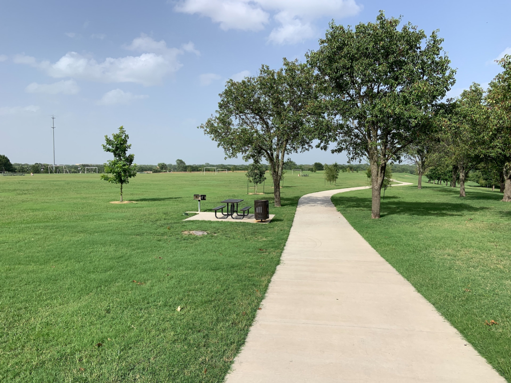 Image of a park pathway for the moving to richardson tx blog article